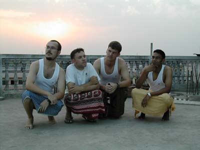 Men in lungis contemplating