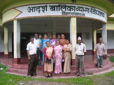 Teachers in Front of Laura's School