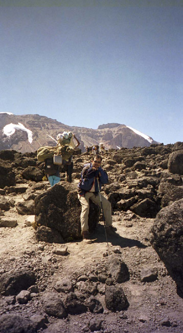 Anjun, taking a rest while the porters pass