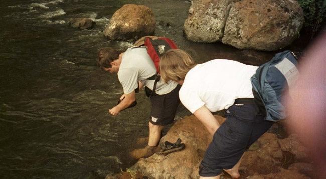 Colin and Laura washing their feet