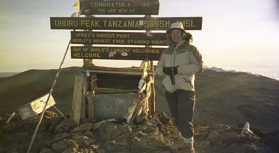 Laura at the top of Kilimanjaro