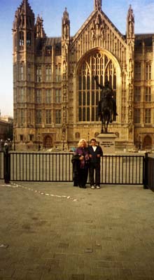 Dorene and Colin in front of part of the Houses of Parliament
