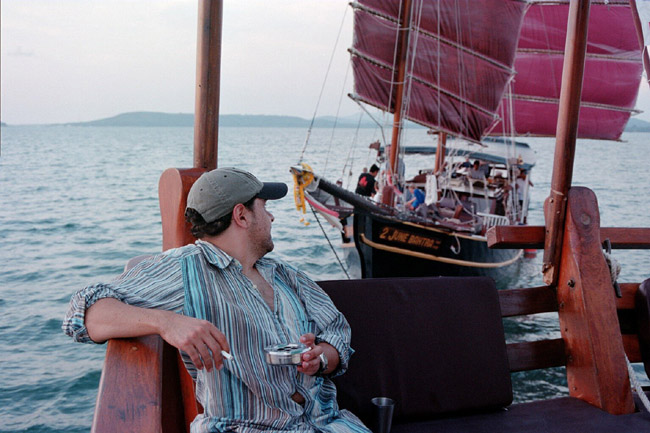 Evan, on the back deck, being chased by another junk