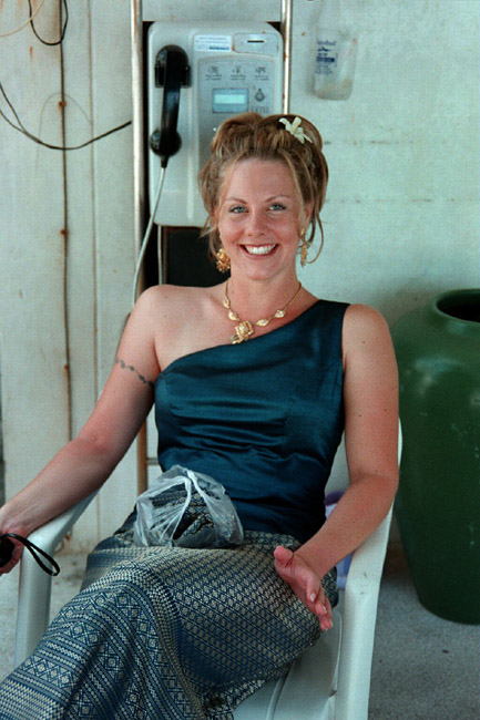 Laura, the bride, waiting outside the hotel for the van to take the bridal party to the wedding location