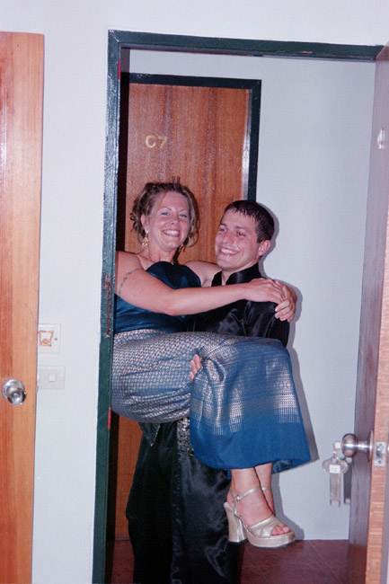 Colin carrying Laura across the threshold