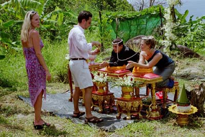 Mark pouring the water, while Debra waits in line
