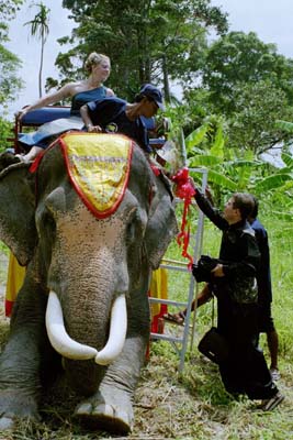 The new bride and groom get in their "limo"